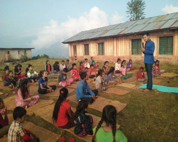 Guru Yogish Aaditya speaking to students